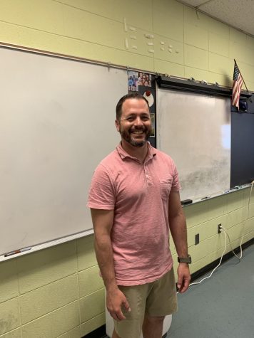 Mr. Pepe pauses for a quick picture while teaching. 