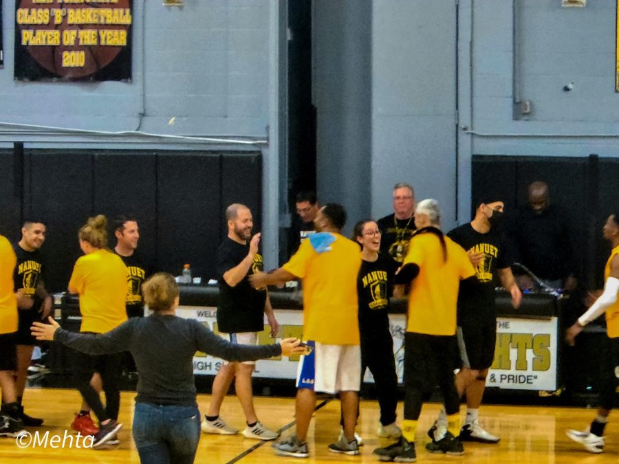 High+fives+all+around+as+the+staff+concludes+this+years+Faculty+Basketball+Game.+