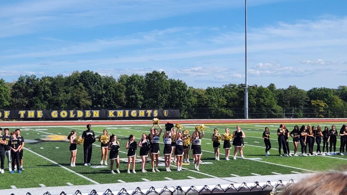 Nanuets Cheer Squad rallies excitement from the crowd during the school Pep Rally on the new field Thursday. September 21. 