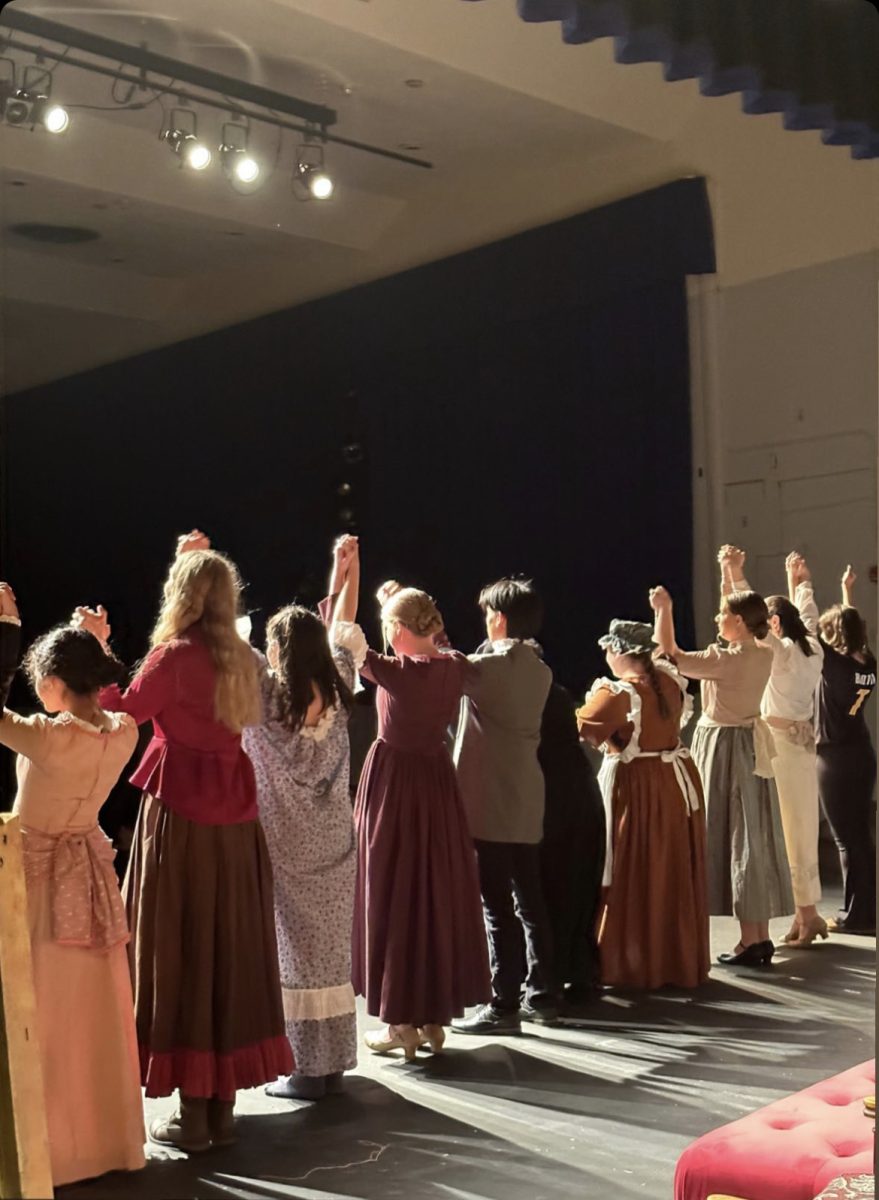The cast members of Nanuets Fall Drama Little Women take their bow at curtain call to the sound of boisterous applause. 