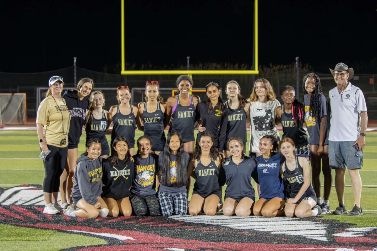 The Girls Track Team proudly poses for a photo. 