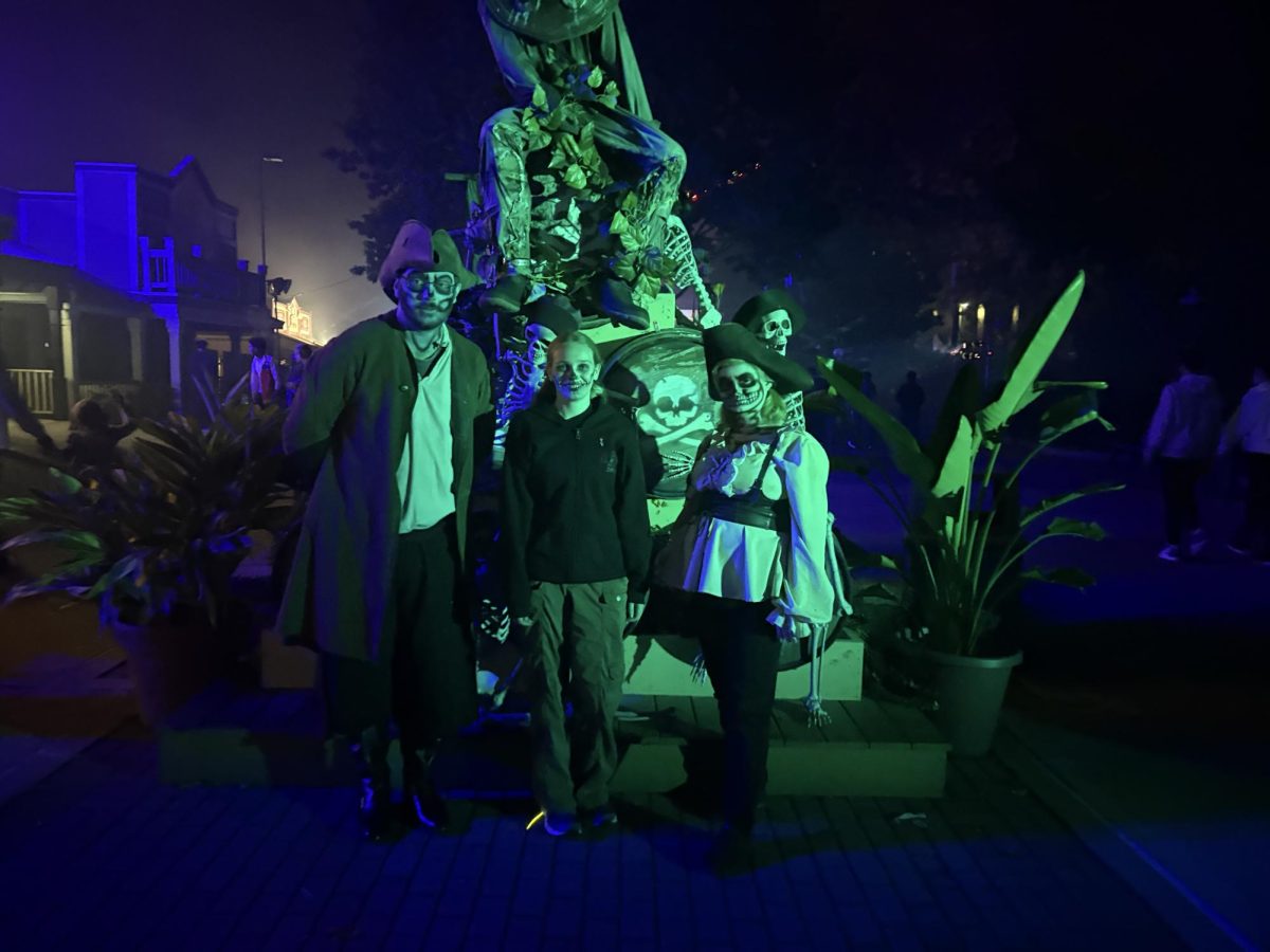 Kristen Schmid and the Skeleton Crew take a picture in the "Port of Call" scare zone at Dorney Park's Halloween Haunt. 