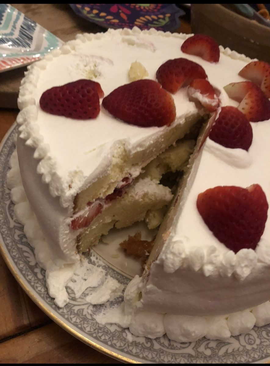 Vanilla frosted cake topped with strawberries for that "Valentine's Day aesthetic," just without the Valentine.