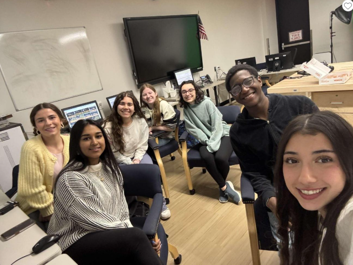 Member of the Yearbook Club pause production momentarily for a quick photo of them hard at work designing the 2025 book, which will be unveiled soon!
