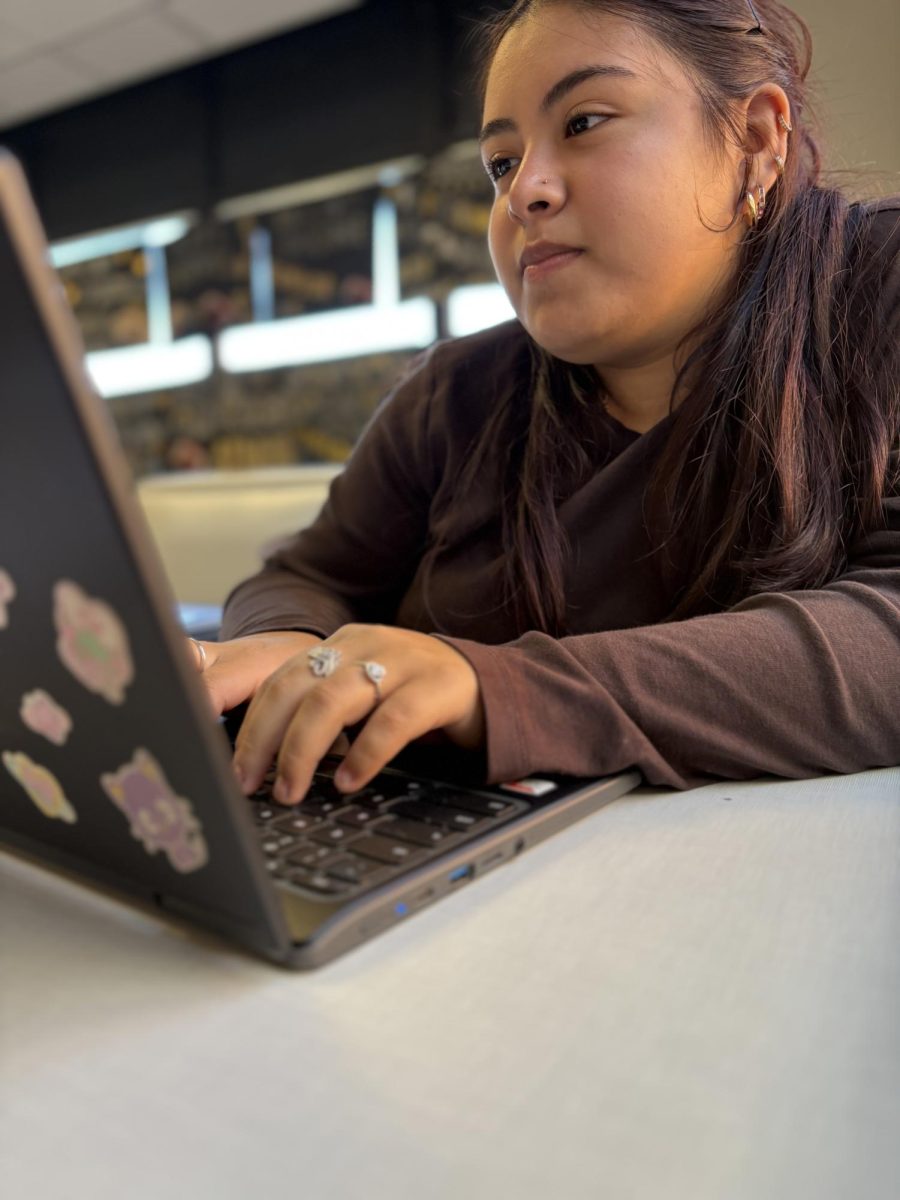 Students like Senior Kailly Martinez are only allowed to use school-issued Chromebooks now that New York State has banned cell phones in schools.