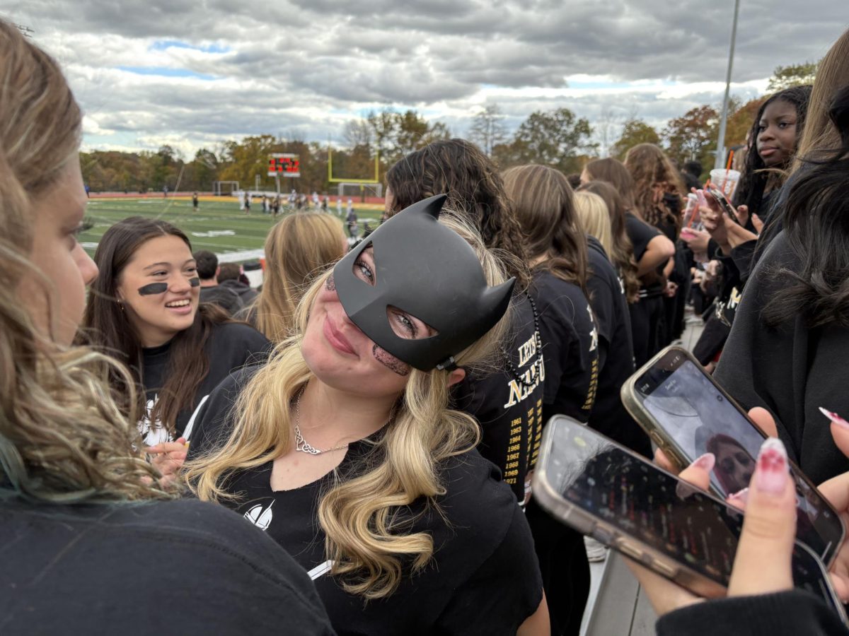 Junior Shea Morahan-Gick poses for a photo during the second quarter of the Brown Jug Game. 